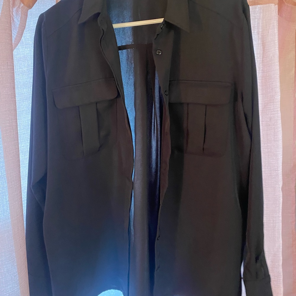 Express Size Large button down blouse. Material is polyester. Large fit.